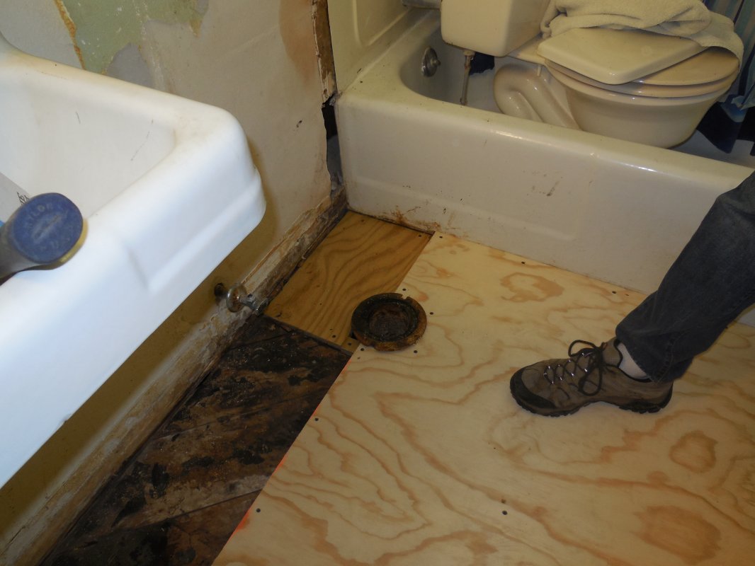 bathrm repaired subfloor around stool:new floor.JPG